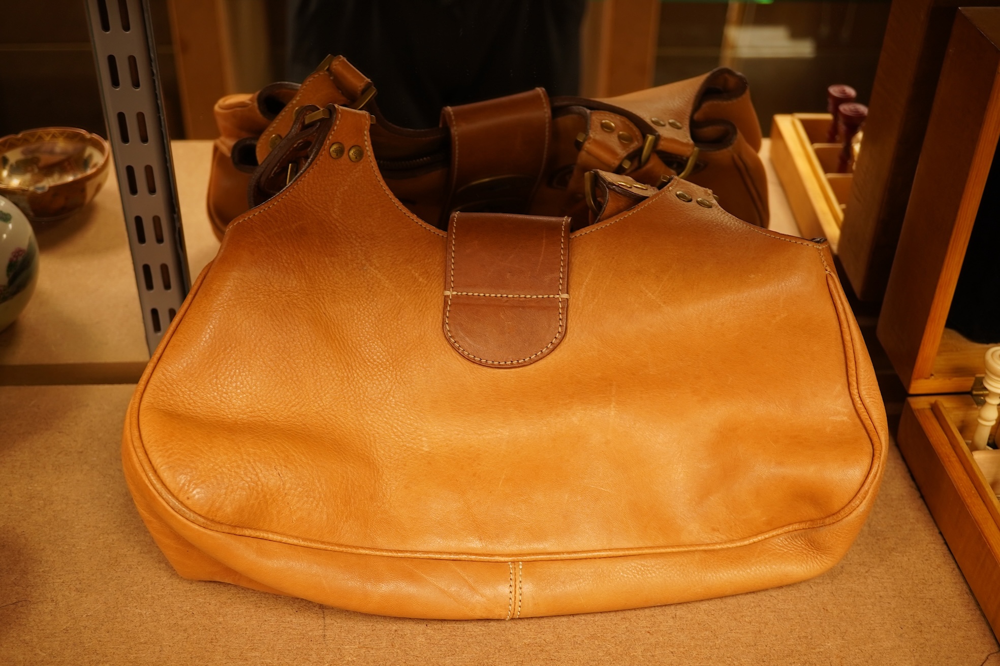 A Mulberry tote two zip, three postman clasps,tan leather with dark brown trim.handbag